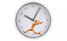 figure running on a hamster-wheel type blurry clockface