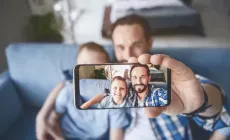 dad and son selfie with phone