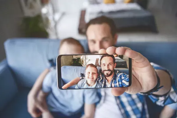 dad and son selfie with phone